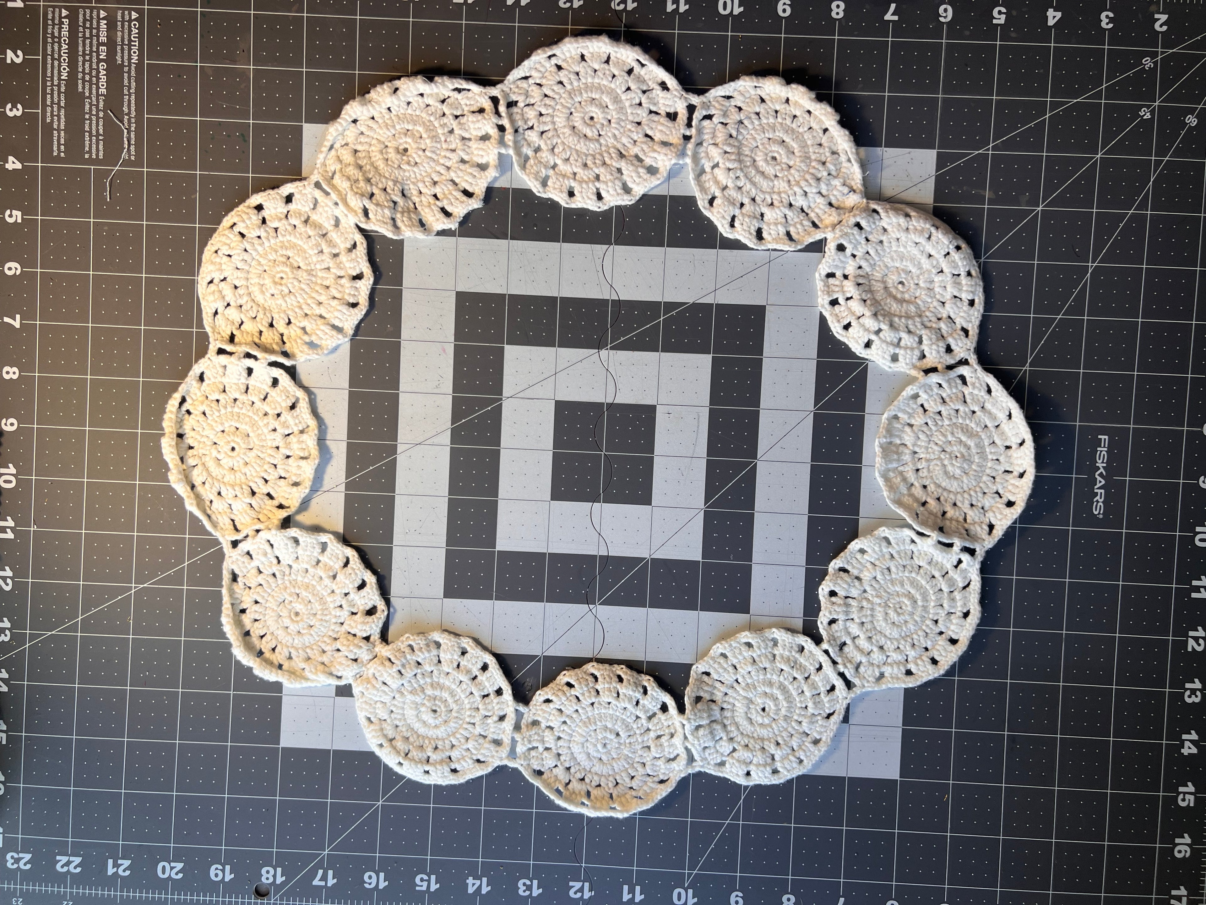 White Cotton Crocheted Ring Trim- 42 inches around. Sewn circles are 3 inches in diameter.